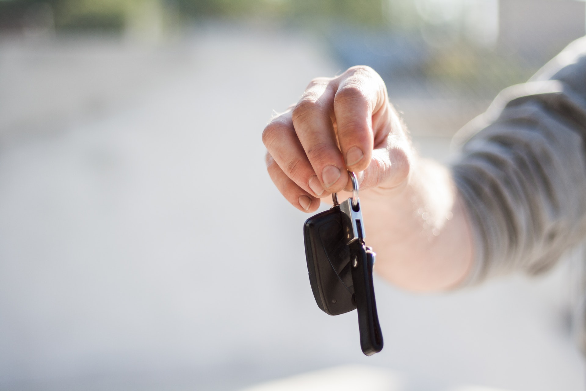 Photo of person holding car keys 