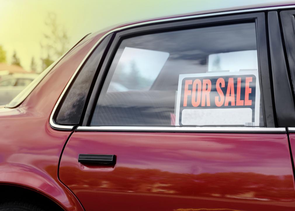 Photo of "For sale" sign in window of used car