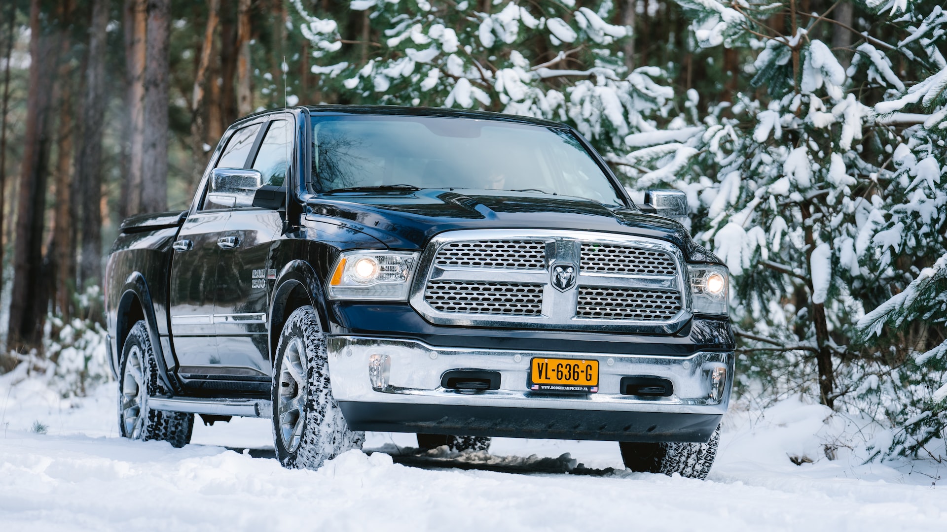 dodge ram pickup truck driving in the snow