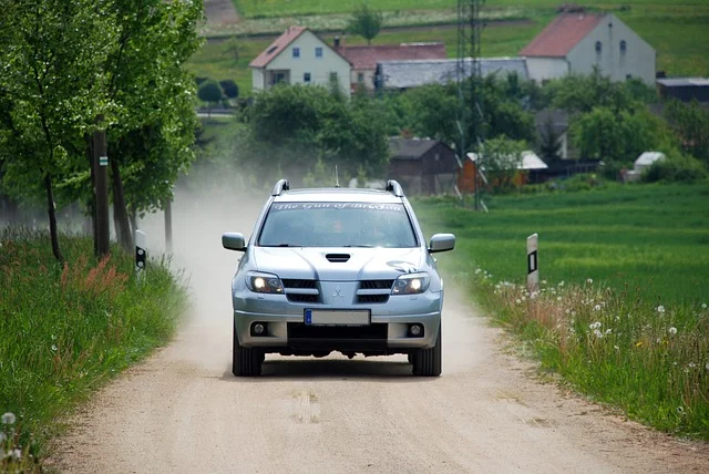 Mitsubishi Outlander driving down a dirt road
