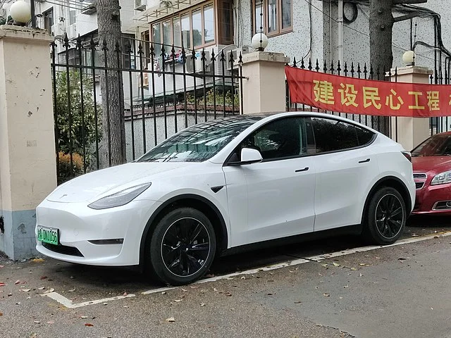White Tesla Model Y parked outside