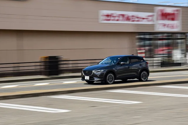 Mazda CX-5 driving through a parking lot