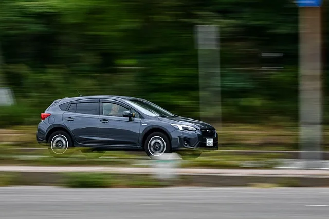 Subaru Impreza driving in a forest