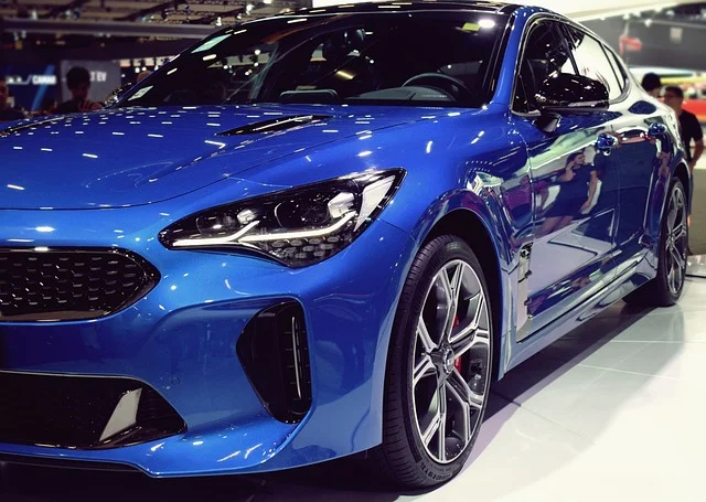 Blue Kia Stinger in a showroom